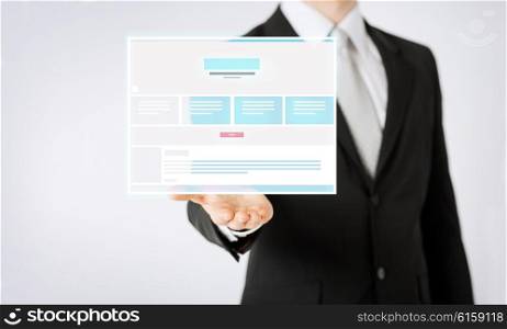 people and business concept - close up of businessman showing web page design template. close up of businessman showing web page design