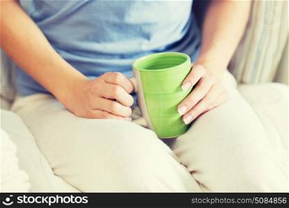 people and drinks concept - close up of young woman with tea cup. close up of young woman with tea cup. close up of young woman with tea cup