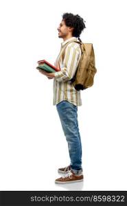 people and education concept - happy smiling man in glasses with backpack and books over white background. smiling man in glasses with backpack and books