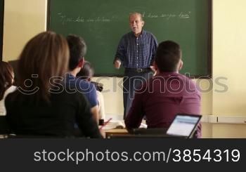 People and education, professor talking to students during lesson in college, Law School, University of Havana, Cuba