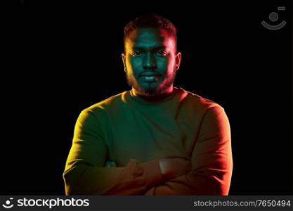 people and ethnicity concept - portrait of young african american man over black background. young african american man over black background