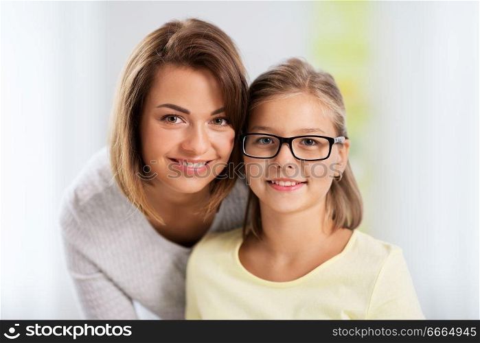 people and family concept - portrait of happy mother and daughter. portrait of happy mother and daughter