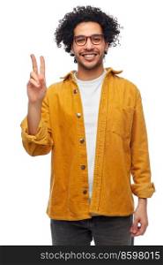 people and fashion concept - happy smiling man in glasses and yellow jacket showing peace gesture over white background. happy smiling man in glasses showing peace gesture