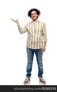 people and fashion concept - happy smiling man in glasses holding something on his hand over white background. happy man in glasses holding something on his hand