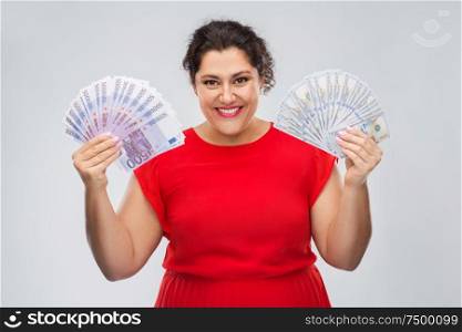 people and finances concept - happy woman in red dress holding hundreds of euro money banknotes over grey background. happy woman holding hundreds of money banknotes