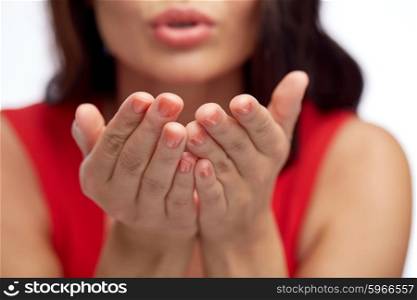 people and gesture concept - close up of woman hands sending blow kiss. close up of woman hands sending blow kiss
