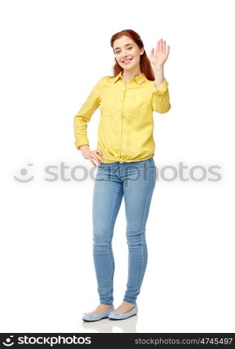 people and gesture concept - happy smiling young woman waving hand over white. happy smiling woman waving hand over white