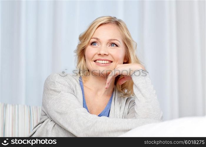 people and leisure concept - happy middle aged woman at home. happy middle aged woman at home