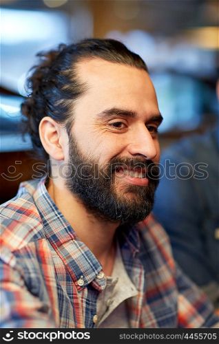 people and leisure concept - happy smiling middle eastern man face with beard. happy smiling middle eastern man face with beard