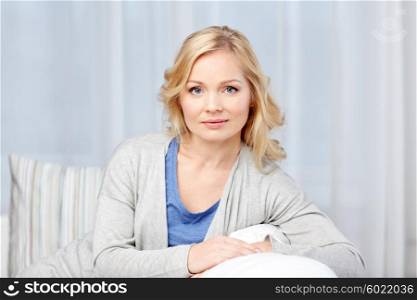 people and leisure concept - middle aged woman at home. middle aged woman at home