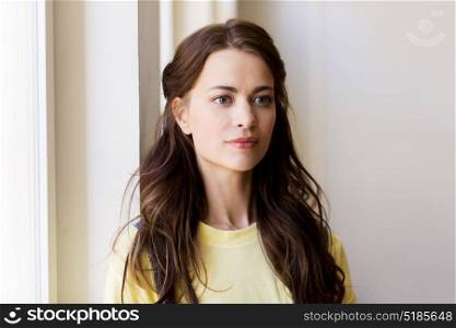people and portrait concept - happy beautiful young woman or teenage girl. portrait of young woman or teenage girl