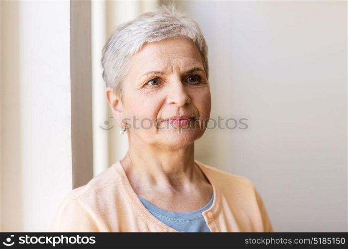 people and portrait concept - happy gray senior woman. portrait of happy gray senior woman