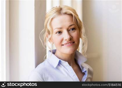 people and portrait concept - happy smiling beautiful blonde woman in shirt. portrait of happy smiling beautiful blonde woman
