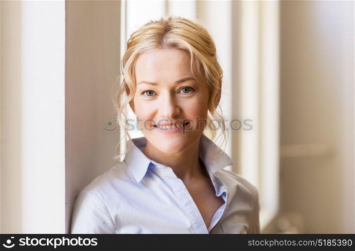 people and portrait concept - happy smiling beautiful blonde woman in shirt. portrait of happy smiling beautiful blonde woman