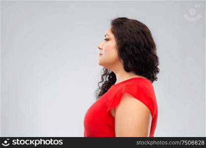 people and portrait concept - woman in red dress over grey background. woman in red dress over grey background