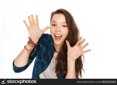 people and teens concept - happy laughing pretty teenage girl showing hands. happy laughing pretty teenage girl showing hands