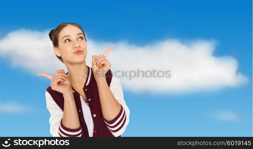 people and teens concept - happy pretty teenage girl with eye makeup over blue sky and clouds background. happy pretty teenage girl