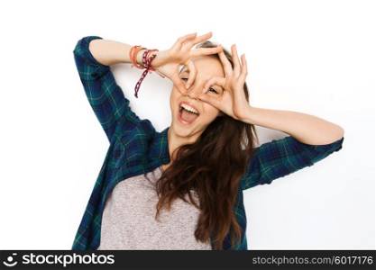 people and teens concept - happy smiling pretty teenage girl making face and having fun. happy teenage girl making face and having fun
