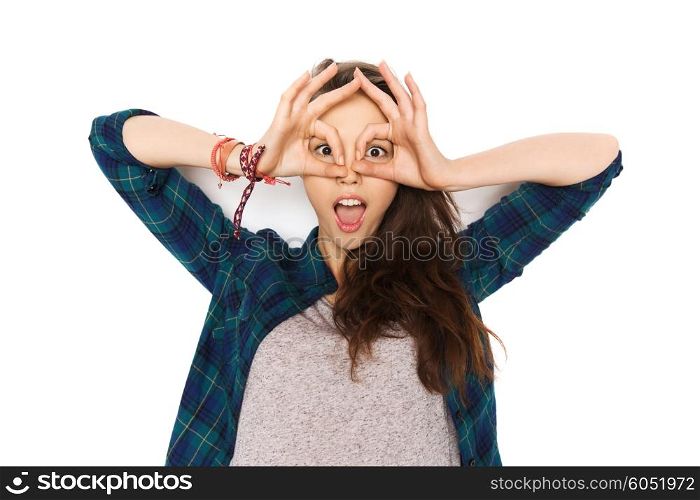 people and teens concept - happy smiling pretty teenage girl making face and having fun. happy teenage girl making face and having fun
