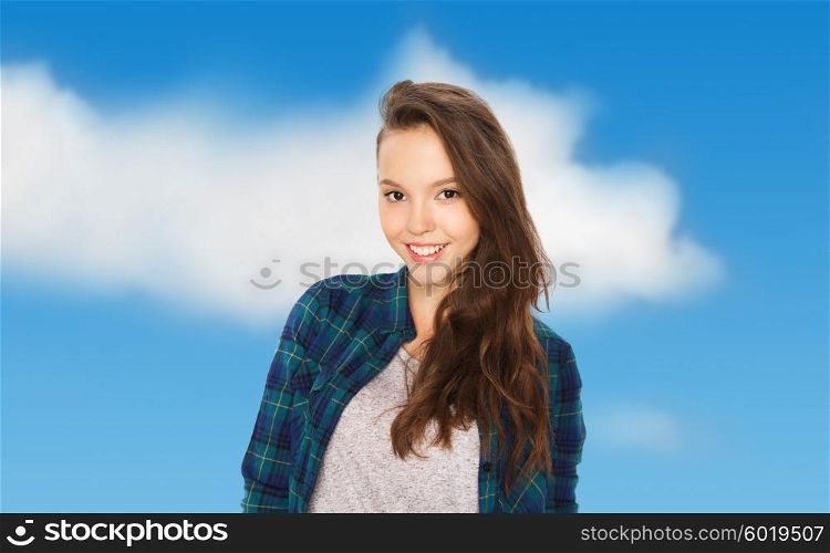 people and teens concept - happy smiling pretty teenage girl over blue sky and clouds background. happy smiling pretty teenage girl