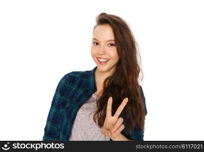 people and teens concept - happy smiling pretty teenage girl showing peace sign. happy smiling teenage girl showing peace sign