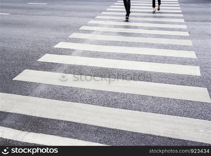 People are walking on the zebra crossing