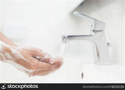 People are washing their hands with soap to protect against Covid 19 virus and bacteria.