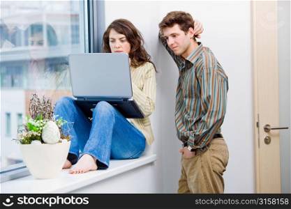 People around a laptop