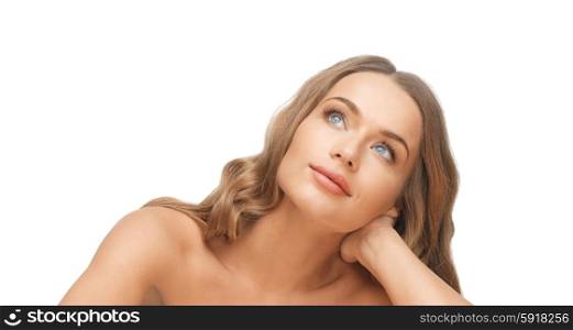 people, beauty and hair care concept - beautiful woman face with long blond hair looking up and dreaming