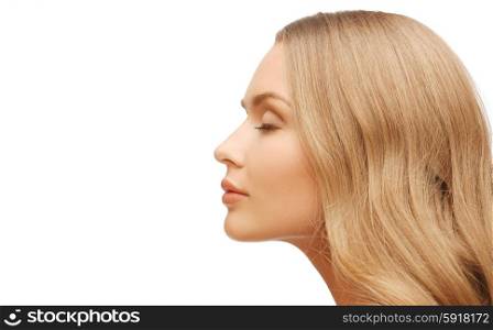 people, beauty and hair care concept - beautiful woman face with long blond hair