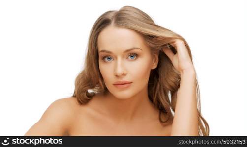 people, beauty and hair care concept - beautiful woman face with long blond hair