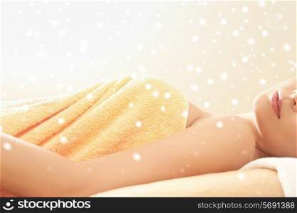 people, beauty, health and leisure concept - close up of beautiful young woman in towel indoors