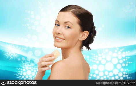 people, beauty, hygiene and summer concept - beautiful woman with soap bar over blue background with waves