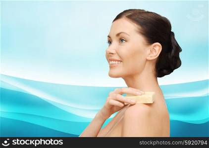 people, beauty, hygiene and summer concept - beautiful woman with soap bar over blue background with waves