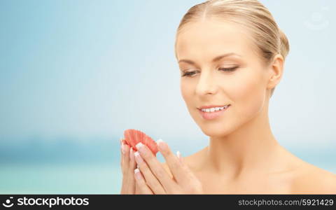 people, beauty, sea and beach concept - beautiful woman with seashell over blue background