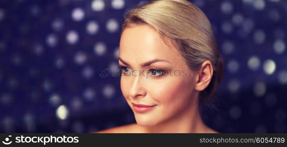 people, beauty, spa, healthy lifestyle and relaxation concept - close up of beautiful young woman sitting in bath towel