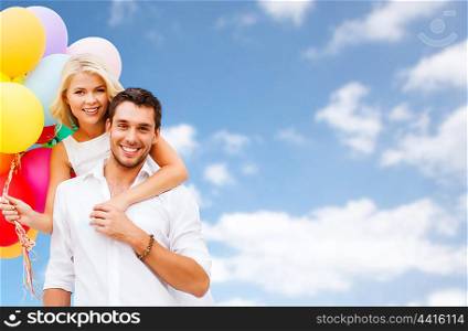 people, birthday, summer holidays, celebration and love concept - happy couple with balloons over blue sky background