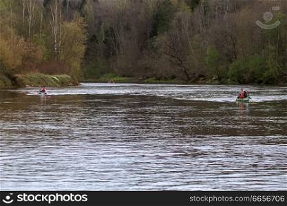 People boating on river Gauja in Latvia, peacefull nature scene.