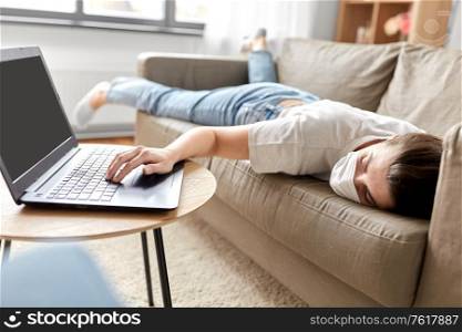 people, boredom and depression concept - sick bored young woman with laptop computer lying on sofa at home. sick bored woman with laptop lying on sofa at home