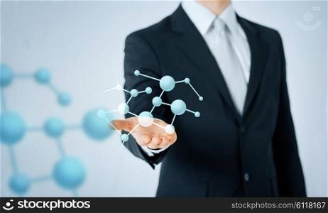 people, business, chemistry, science and biology concept - close up of man hand showing molecule formula projection