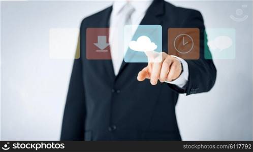 people, business, technology and computing concept - close up of man pointing finger to cloud icon projection