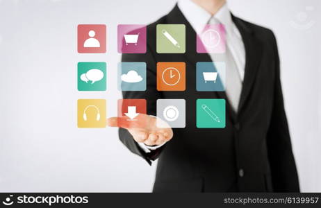 people, business, technology and management concept - close up of man hand showing application menu icons projection