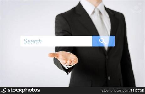 people, business, technology and networking concept - close up of man hand showing internet browser search bar projection