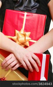 People celebrating holidays, love and happiness concept - girl with golden red gift boxes isolated