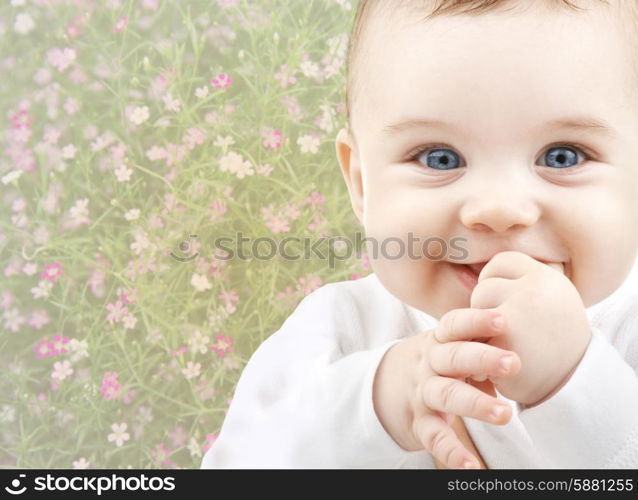 people, childhood, spring and happiness concept - close up of happy smiling baby over floral background