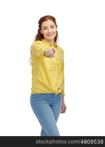 people, choice and gesture concept - happy young woman pointing finger on you over white
