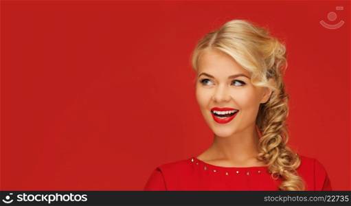 people, christmas and advertisement concept -lovely smiling woman in red