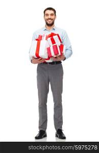 people, christmas, birthday and holidays concept - happy young man holding gift boxes