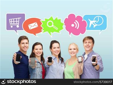 people, communication, advertisement and technology concept - smiling friends showing blank smartphones screens over blue background with doodles