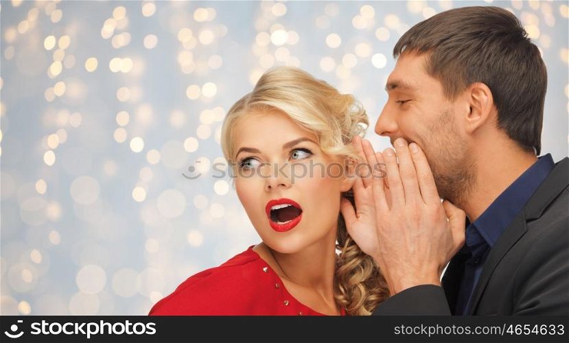 people, communication, christmas , holidays and information concept - close up of man and woman spreading gossip over holidays lights background